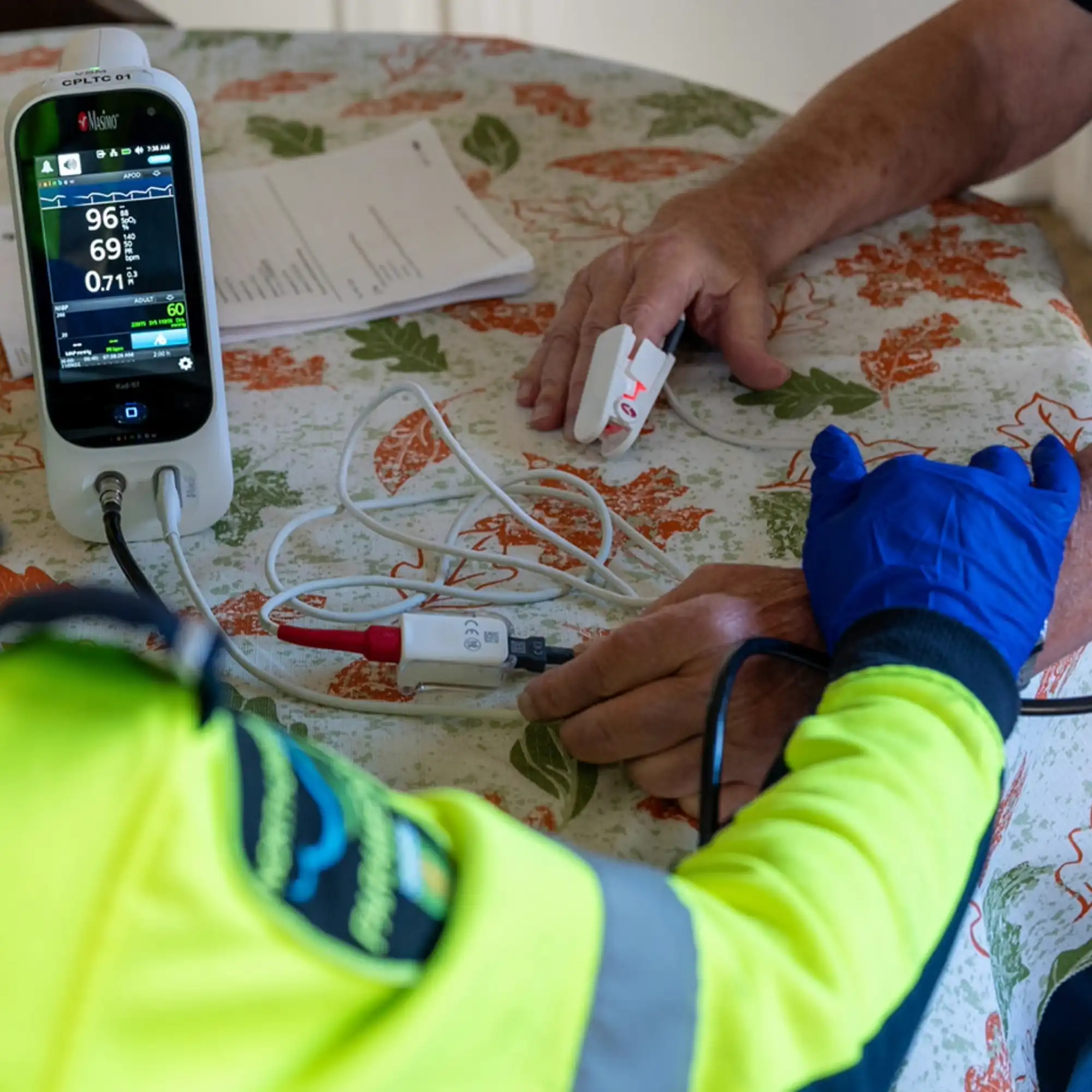 Community Paramedic taking running a test on a client in their home. 