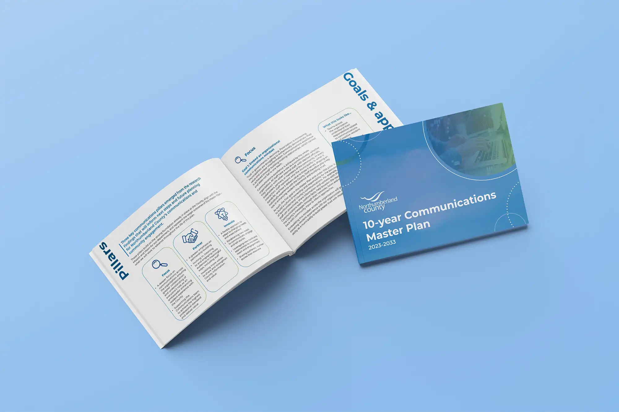 Communications Master Plan cover and interior spread