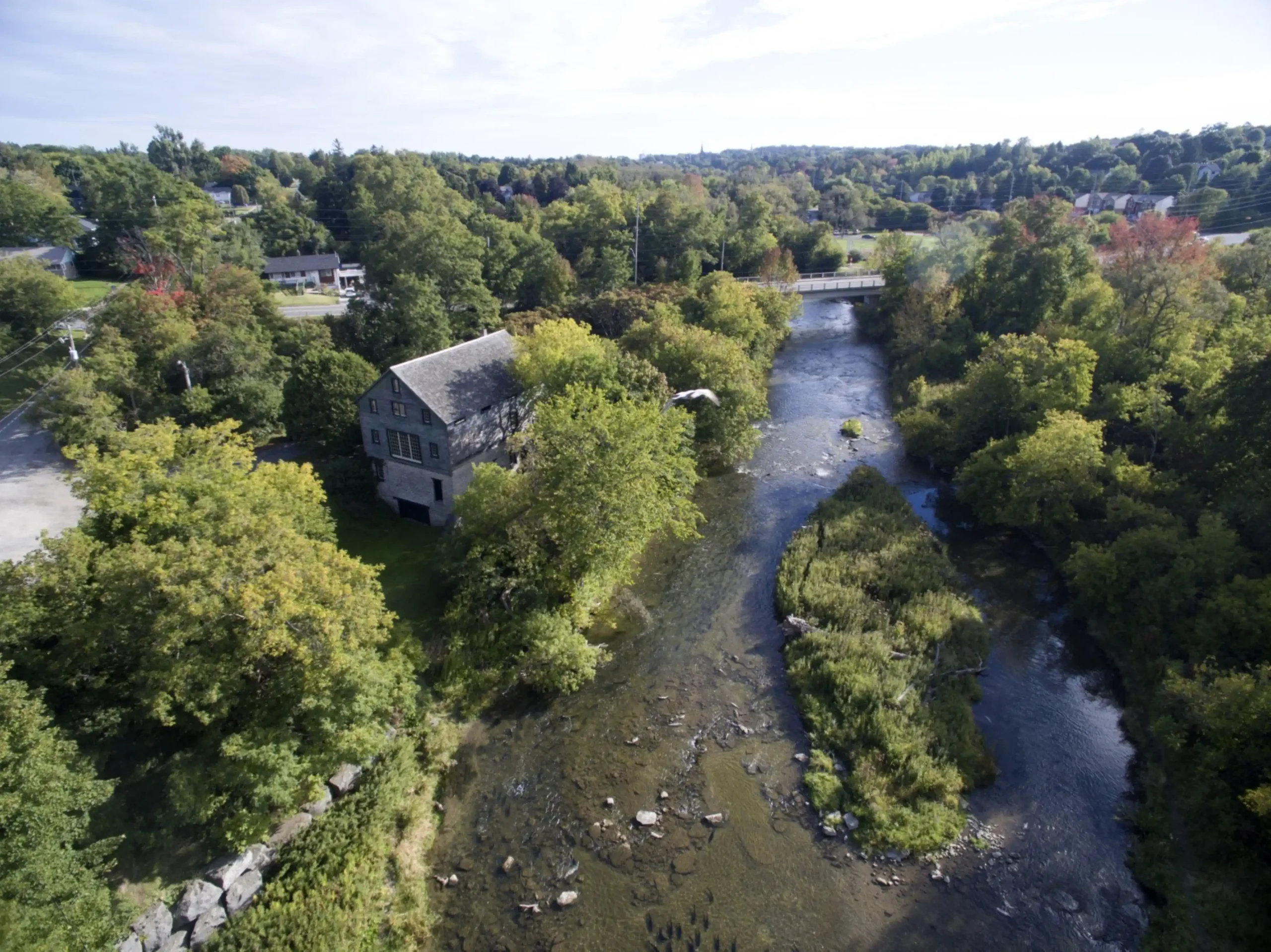 Aerial view of historic downtown with river crossing through