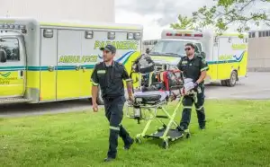 Paramedics pushing stretcher