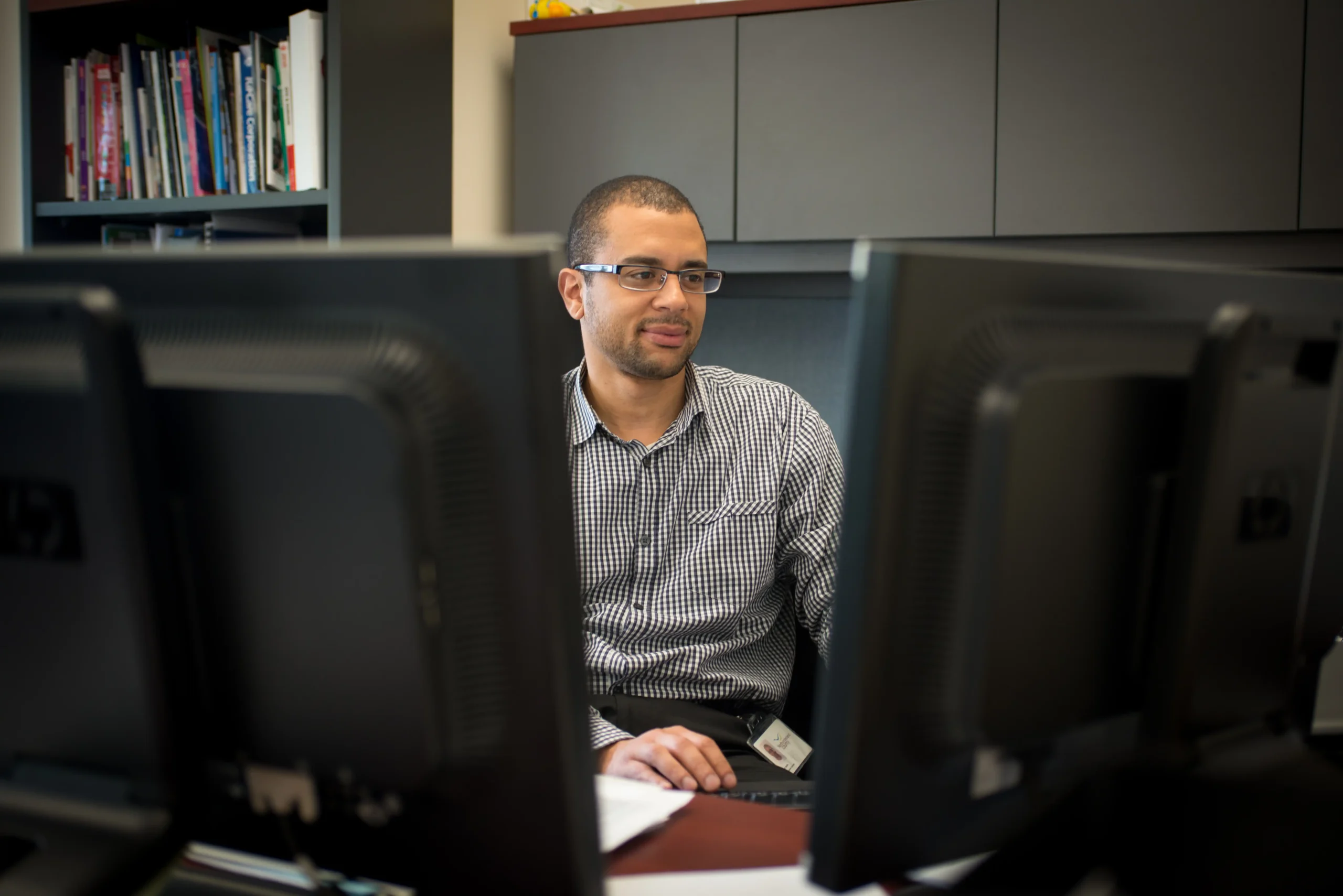 Purchasing Team Member Finance team member works behind computer