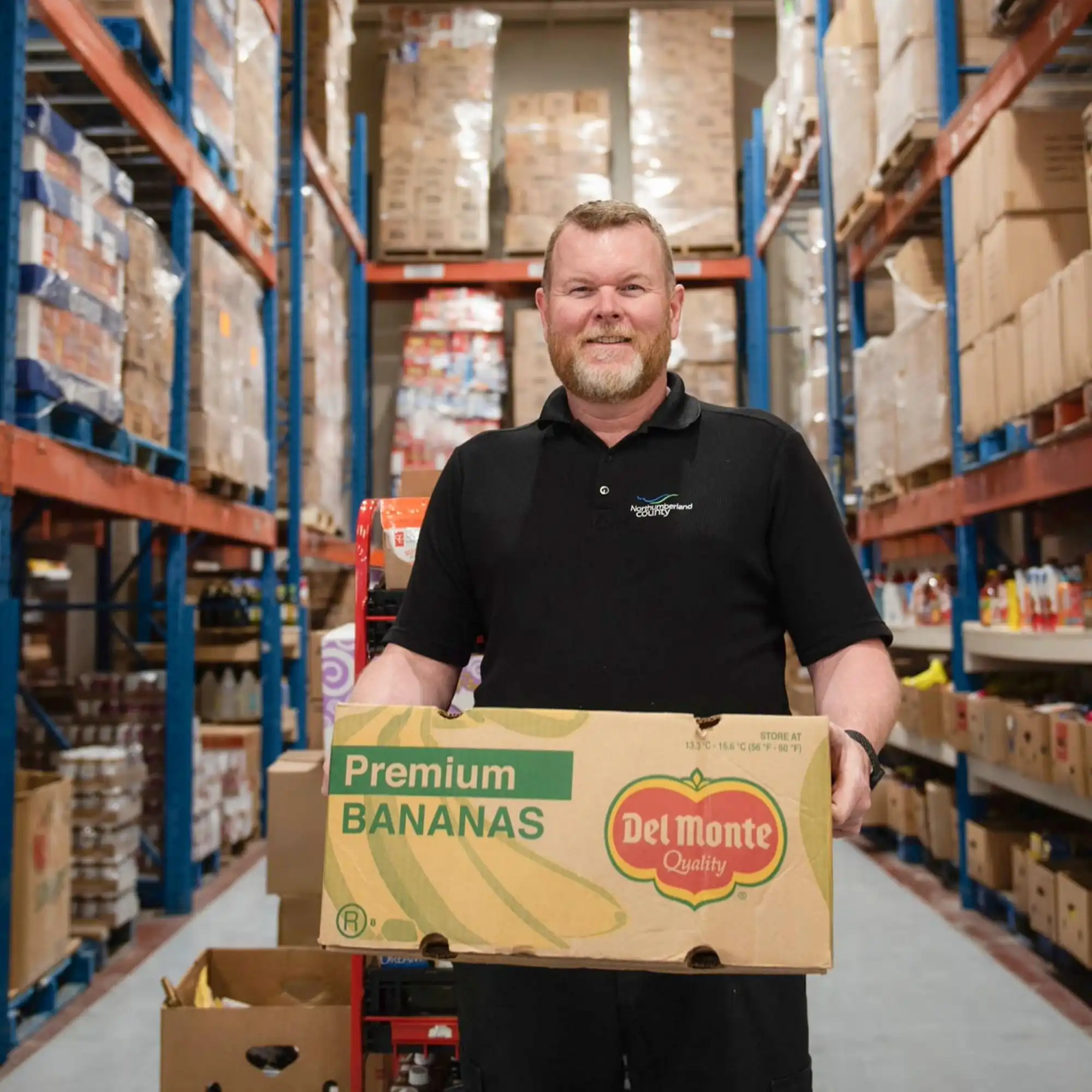 County staff mmeber working in the Food 4 All warehouse 