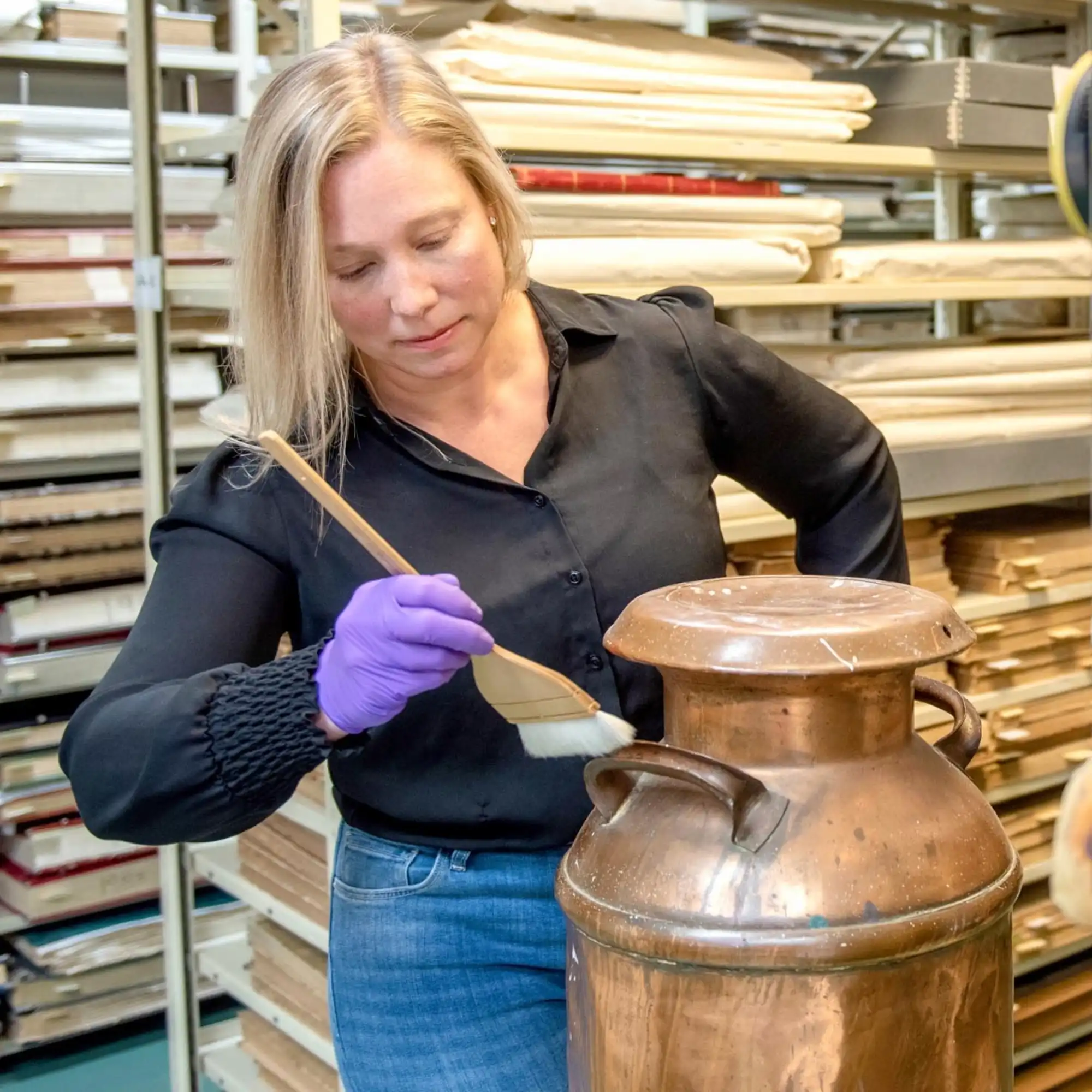 Curator at the Archives working on an Artiefact 